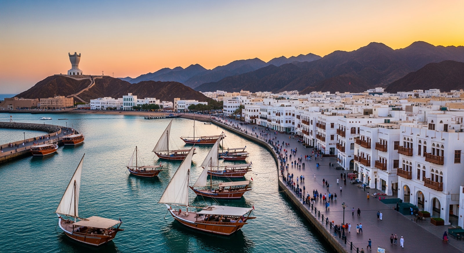 Aerial view of Mutrah Corniche and harbor in Muscat Oman with traditional dhow boats