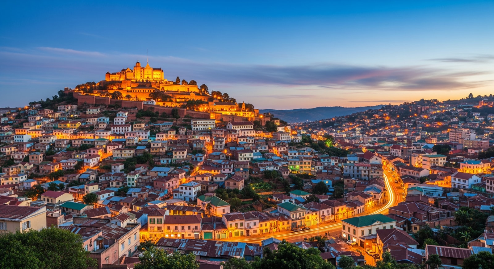 Panoramic view of Antananarivo city with the Rova royal palace on the hilltop overlooking colorful houses