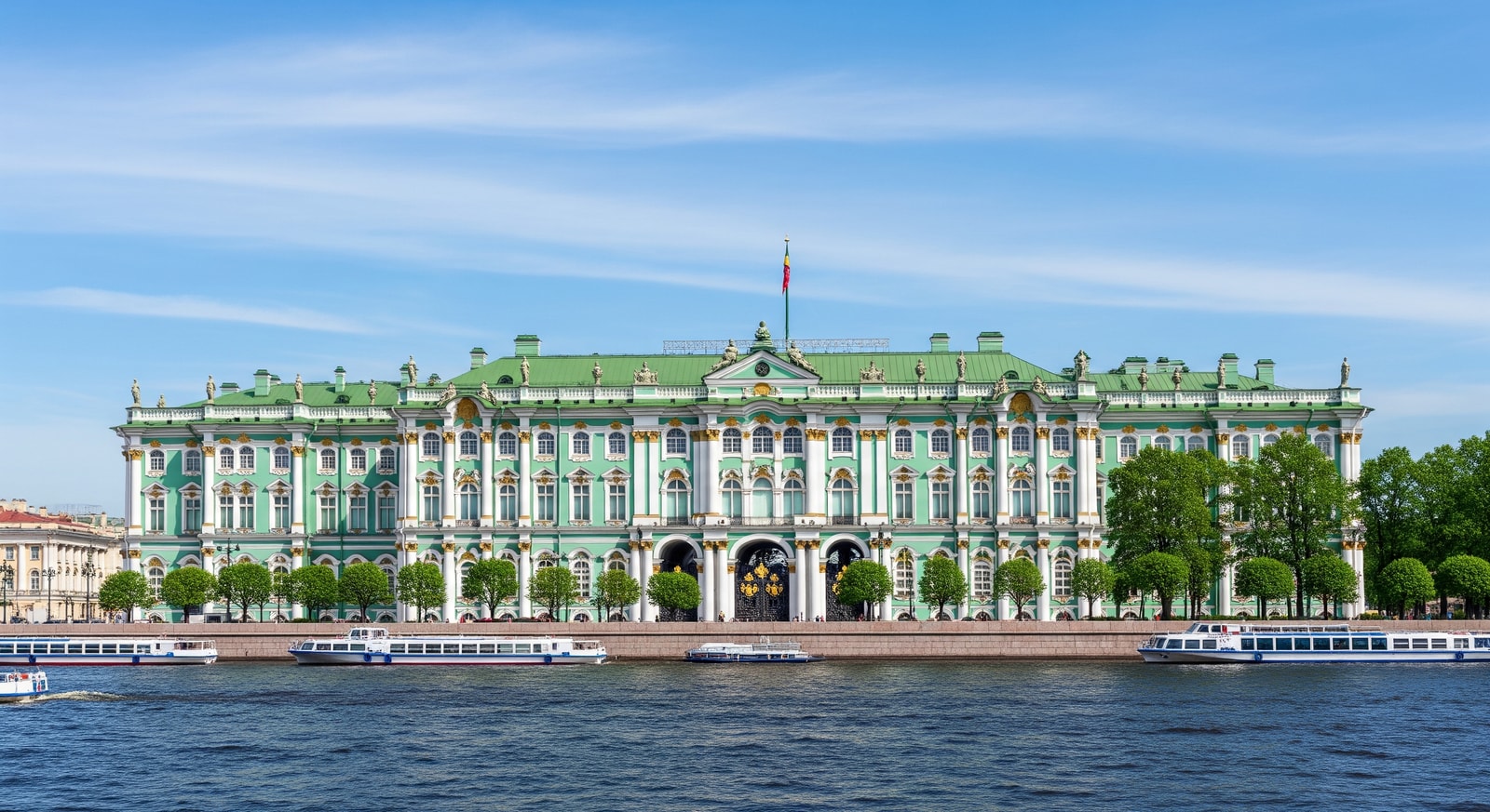 The grand green and white facade of the Winter Palace housing the Hermitage Museum in Saint Petersburg