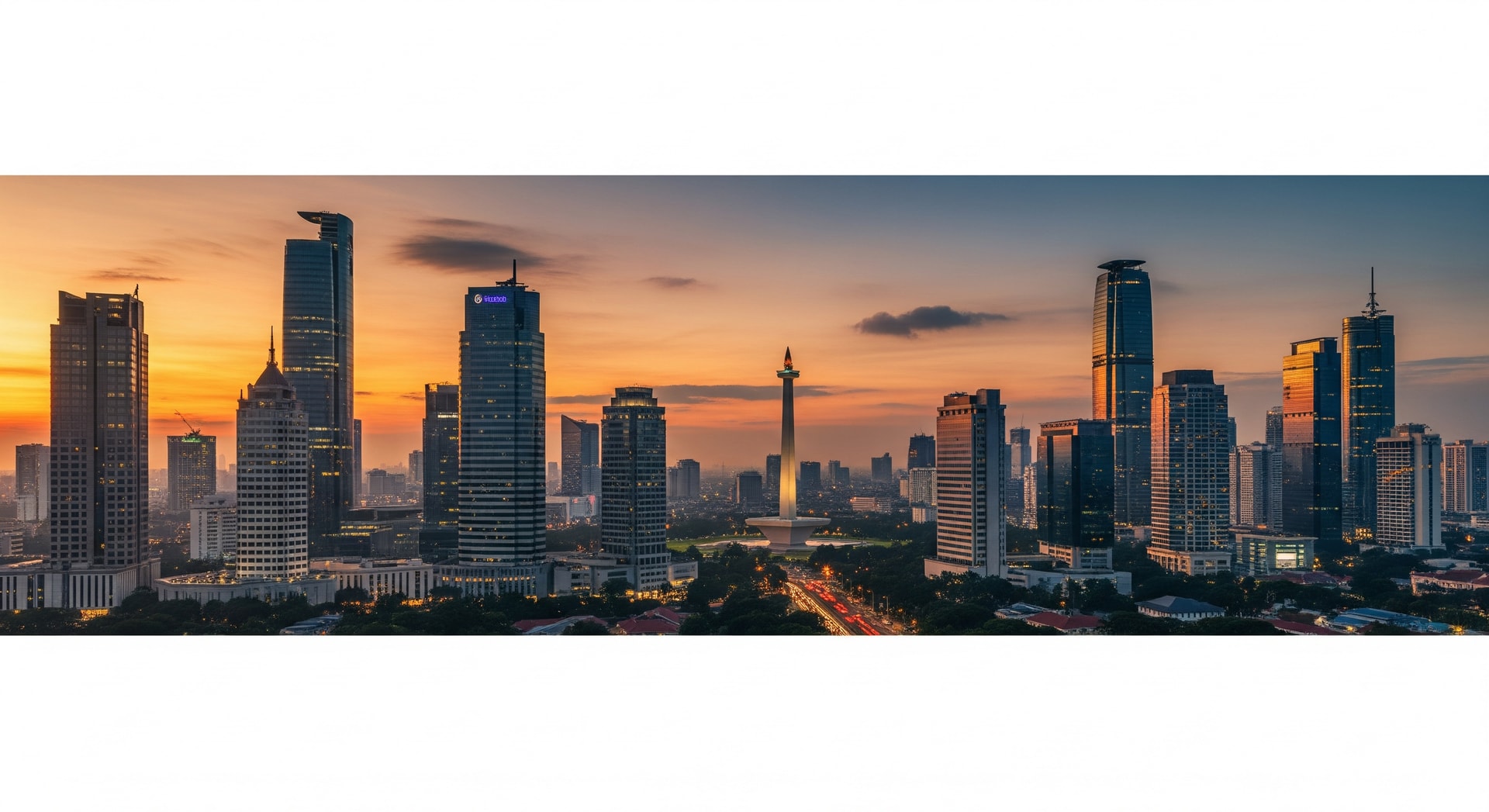 Panoramic view of Jakarta skyline at sunset with modern skyscrapers and the National Monument representing Indonesia's dynamic growth and institutional landscape