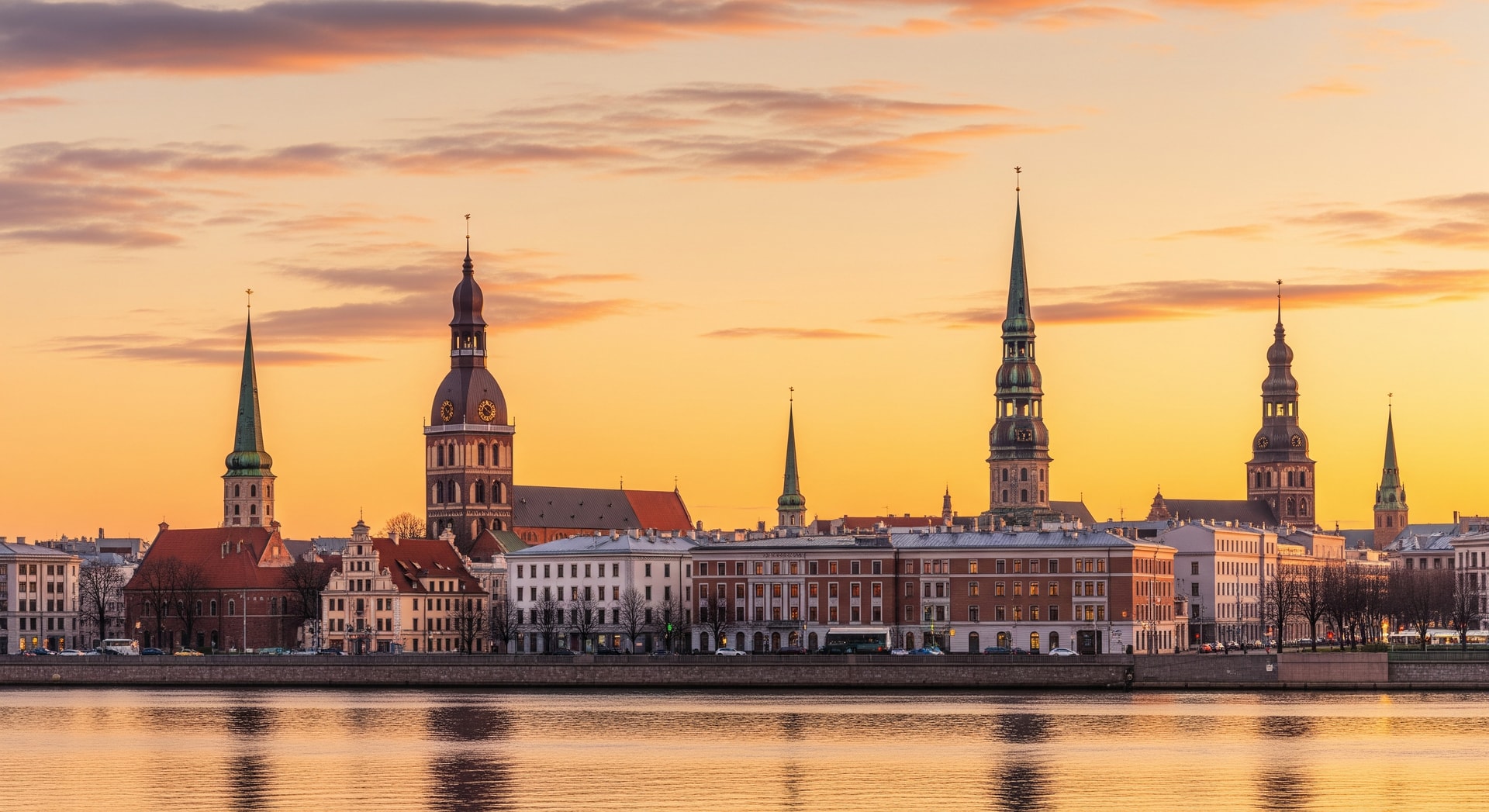 Panoramic view of Riga Old Town with the Daugava River and historic spires representing Latvia's rich cultural and administrative heritage