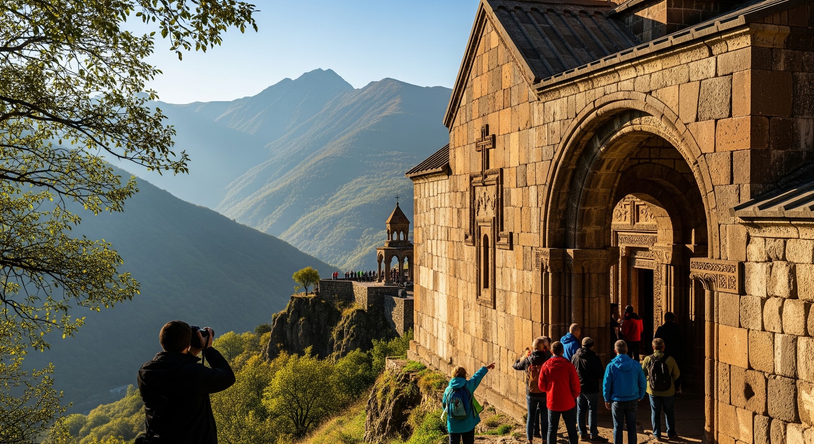 Tourists visiting an Armenian monastery and mountain landscape illustrating tourism attractions