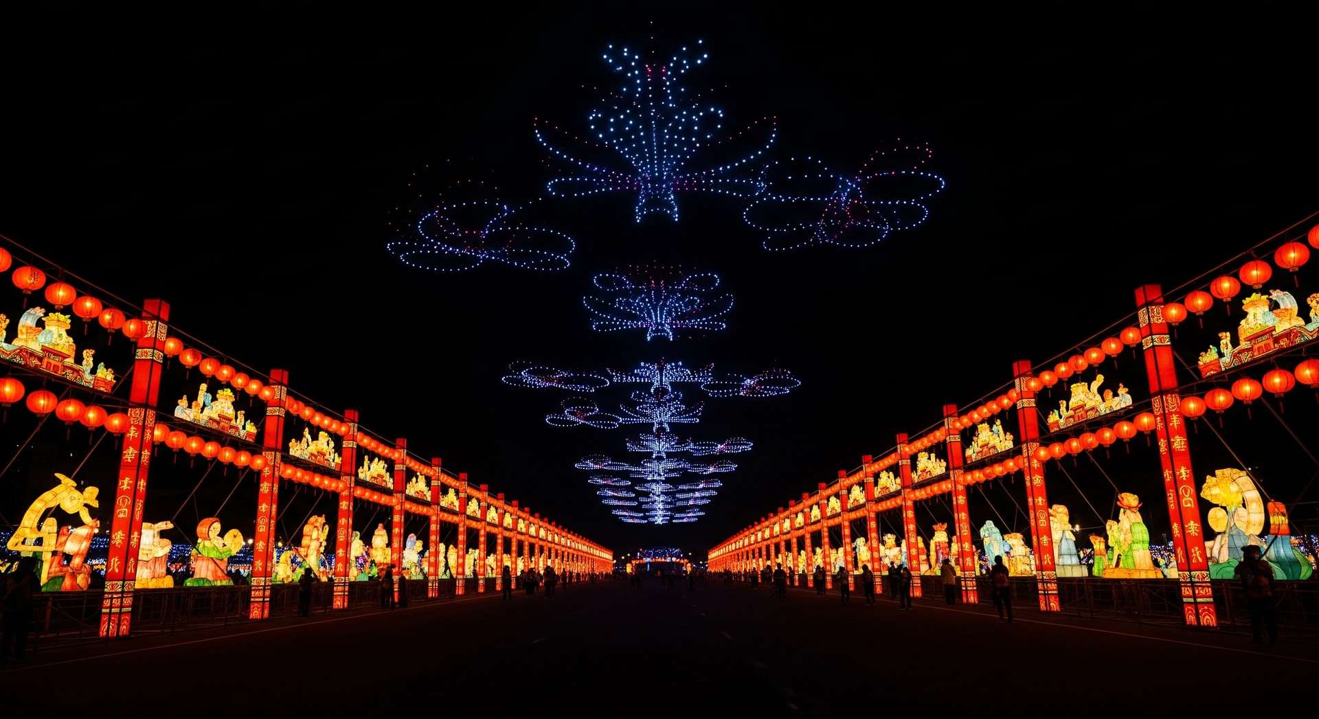 Night view of illuminated lantern installations and drone lights at a Taiwanese festival